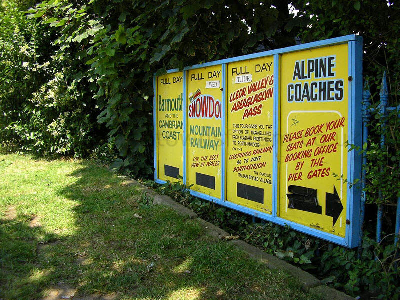 ALPINE COACHES ADVERTISING BOARDS AT PIER ENTRANCE
